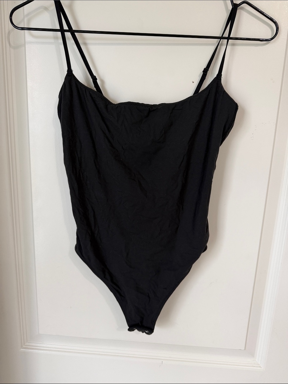 SKIMS Black Seamless Bodysuit Label Detail